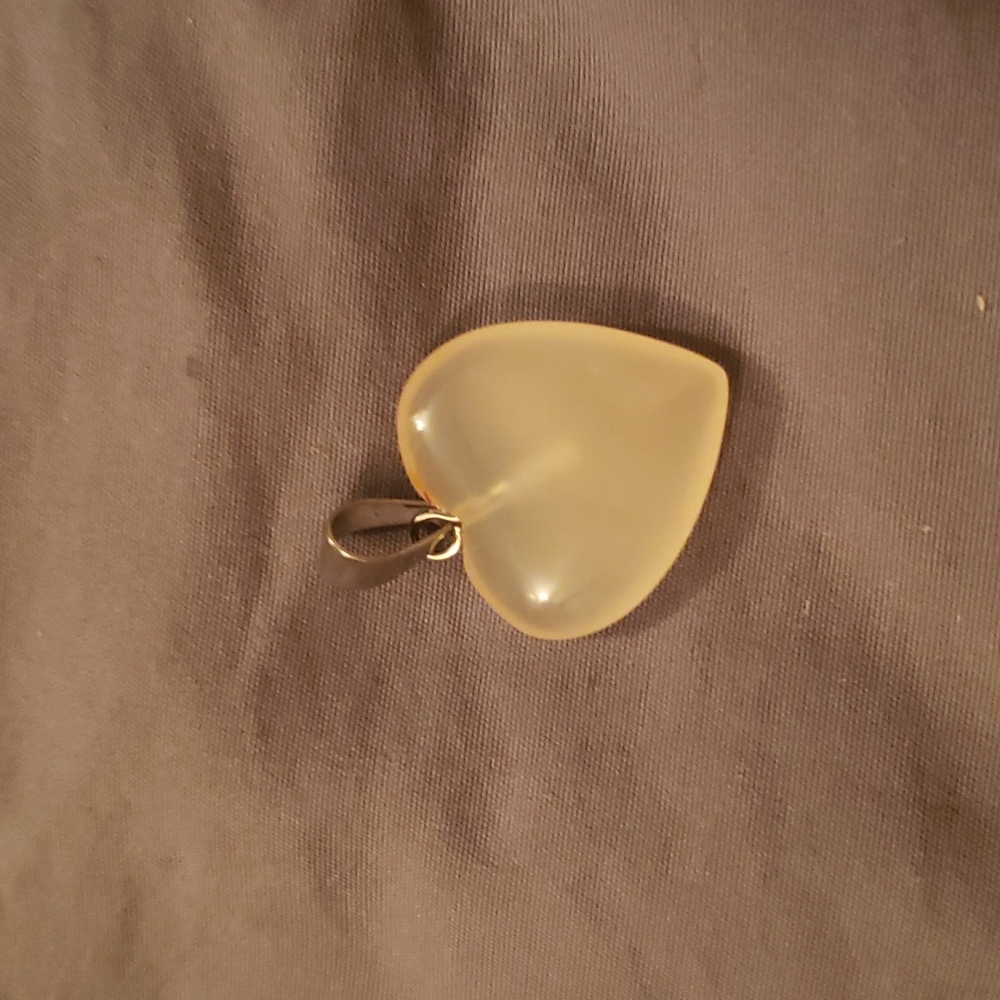 Carnelian Heart pendant with a silver tone bail